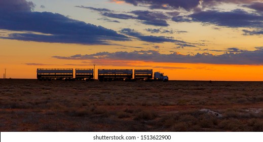 road train on the background of the setting sun - Outback Australia