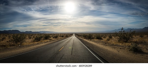 A Road Traveling Across The Mojave Desert In California U.S.A.