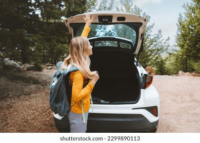 Road trip adventures woman traveling by rental car summer vacations active lifestyle weekend getaway outdoor  - Powered by Shutterstock