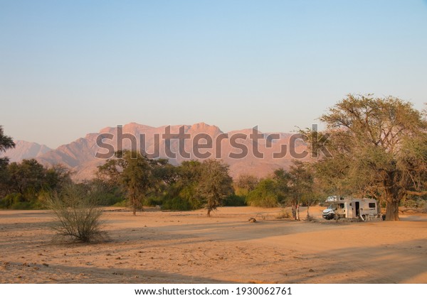 Road trip in a\
camper home through the beautiful Damaraland, Namibia. wied spread\
and lonesome camp site near Brandberg. Desert elephants walk\
through this camp site at\
night