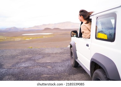 Road Trip Car Holiday Happy Couple Driving Jeep Car On Summer Travel Iceland Vacation. Woman With Arms Up Having Fun. Freedom Concept