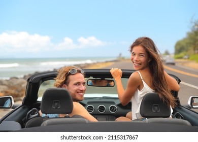 Road Trip Car Rental Travel Happy People Young Tourists Couple Smiling At Camera Driving On Summer Vacation Travel. Asian Woman, Caucasian Man