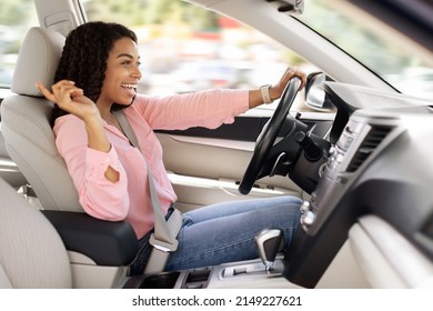 Road Trip Concept. Profile Side View Portrait Of Excited Playful Black Woman Driving Luxury Car, Dancing To Music And Singing Favorite Song, Resting On Weekend Going On Vacation Or Home From Work