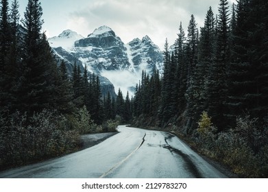 Road trip on highway with rocky mountains in pine forest at Banff national park, AB, Canada - Shutterstock ID 2129783270
