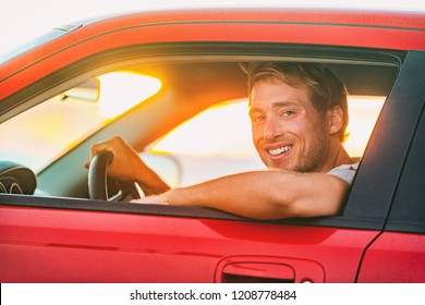 Road Trip Summer Travel Vacation Man Driving Electric Car Sportscar . Male Driver At Window Behind Wheel Of New Eco-friendly Green Energy Vehicle In Sunset. Young Male Owner Taxi Driver Concept.