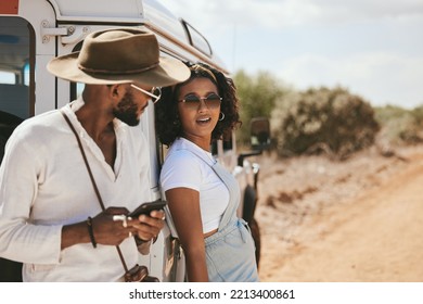 Road Trip, Travel And Black People With Smartphone For Safari Guide App, Location Update And Social Media Outdoor Journey Post With 5g Network. Gen Z Couple With Cellphone And Caravan In Countryside