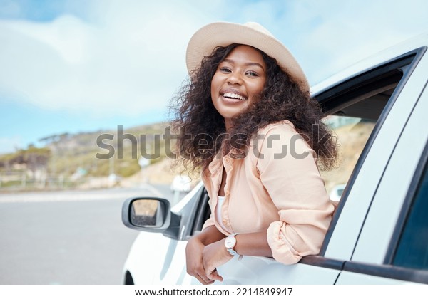 Road trip travel, black woman and car window\
freedom to relax in summer, vacation and outdoor adventure in South\
Africa countryside. Portrait happy young african female, driving\
journey and transport