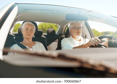 Road Trip, Travel And Old People Concept - Happy Senior Couple Driving In Car