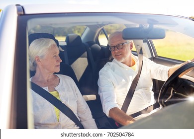 Road Trip, Travel And Old People Concept - Happy Senior Couple Driving In Car