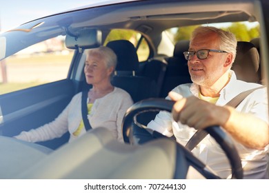 Road Trip, Travel And Old People Concept - Happy Senior Couple Driving In Car