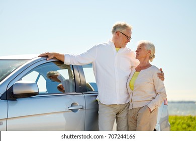 road trip, travel and old people concept - happy senior couple at car in summer - Powered by Shutterstock