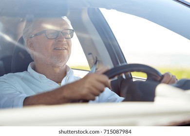 Road Trip, Travel And Old People Concept - Happy Senior Man In Glasses Driving Car