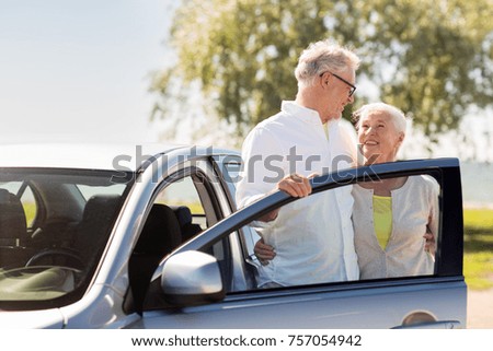 road trip, travel and old people concept - happy senior couple with car in summer