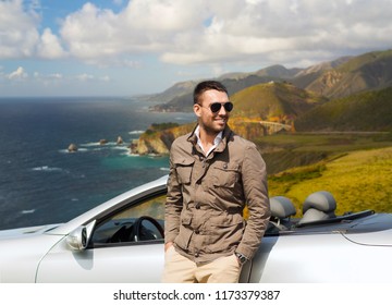 Road Trip, Travel And People Concept - Happy Man At Convertible Car Over Big Sur Hills Background In California