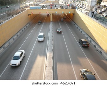 road tunnel under bridge at day