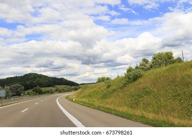 Road under cloudy sky