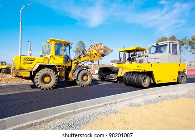 Road Under Construction - Wheel Loader Machine, Pneumatic Tyred Roller And Tracked Paver At Asphalt Pavement Works