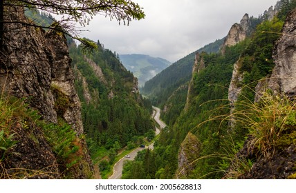 Road in a valley from above. Forest with rocks view. Vratna dolina, Mala Fatra, Slovakia. - Shutterstock ID 2005628813