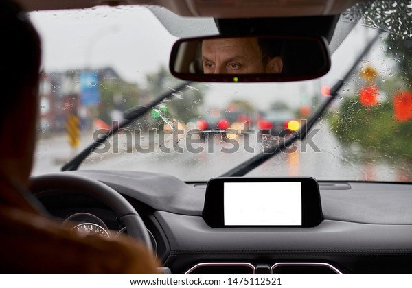 Road view through car
window blurry with heavy rain, Concept of driving in rain, bad
driving conditions