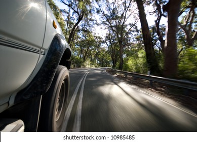 Road view of vehicle speeding by on country road