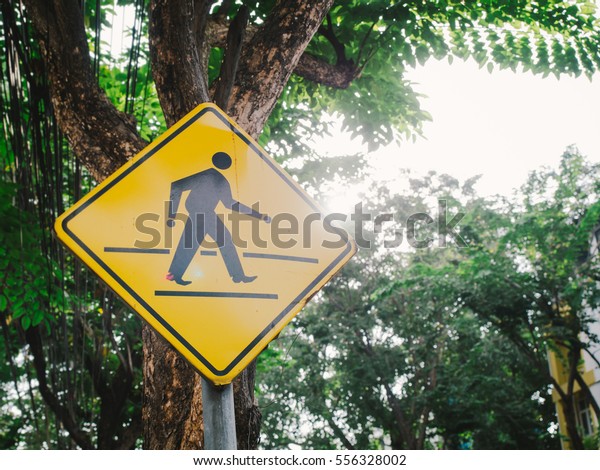 Road warning signs, man\
crossing sign