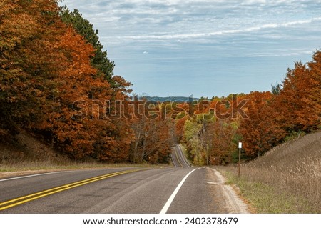 Road way through blazing colors in Grand Traverse area