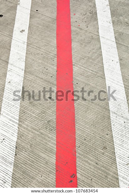 Road with white and red \
lines
