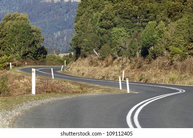 Road Winding Through The East Coast Of Tasmania, Australia