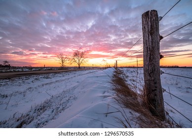 Road in winter sunset