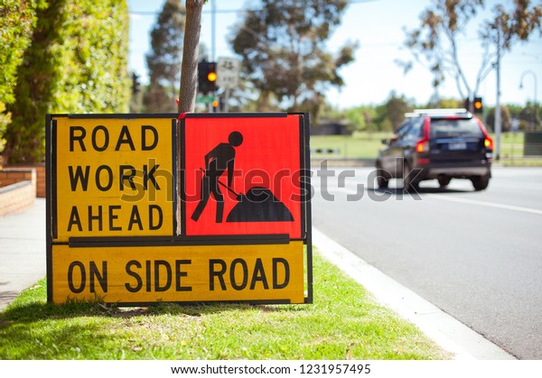 Road work\
sign. Australia, Melbourne. City street.\
