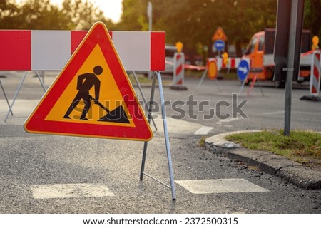 Road work traffic sign, highway maintenance construction site, selective focus