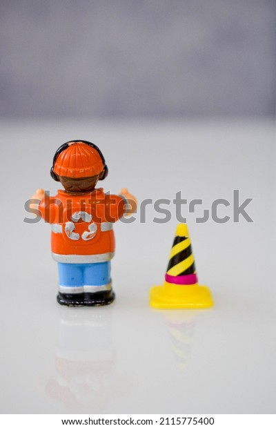 road worker or worker with a jackhammer in\
various situations on the road, dolls\
