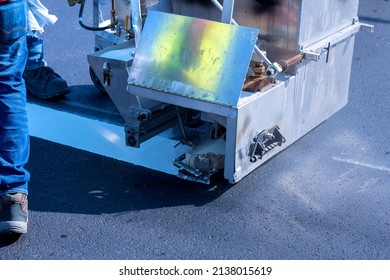 Road Worker Thermoplastic Spray Marking Machine Painting Work On The Street