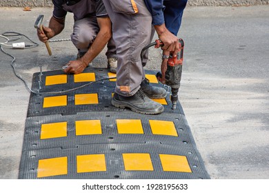 Road workers putting speed bumps in Bosnia and Herzegovina