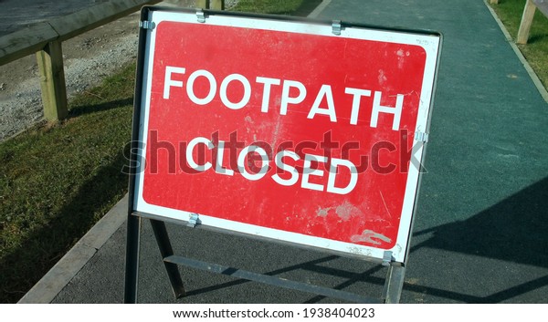Road works, closed\
footpath on a sunny day