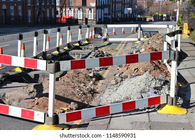 Road Works In Liverpool, UK. Street Repair Sealed Off With Barriers.