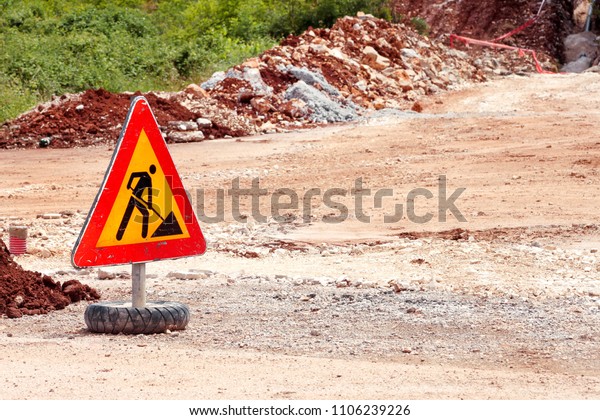 Road works sign for construction works,\
pavement construction. Traffic, warning sign road repairing, road\
maintenance. Red, black, yellow triangle road sign work.\
Reconstruction and\
infrastructure.