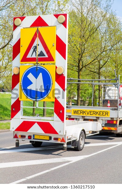 Road works with truck and traffic signs in\
the Netherlands