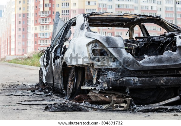 Road wreck accident or arson fire burnt wheel car\
vehicle junk