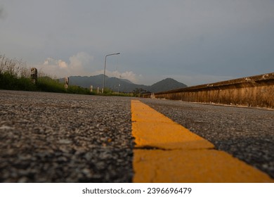 Road,pathway along the dam in the evening, near sunset. - Powered by Shutterstock