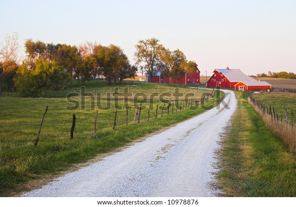 Roads in countryside surrounded by colorful\
fields and meadows