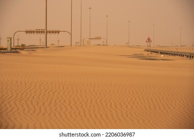 Roads Are Covered With Desert Sand After Sand Storm. No Place For Vehicle To Pass The Road. Sand Storm Road Block By Desert Sand. Desert Road Blockage After Sandstorm In Middle East. 