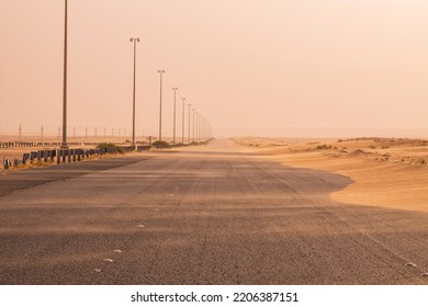 Roads are covered with desert sand during sand storm. Sand storm road block. Desert road blockage. Sand moving from one end of the road to other end and get accumulate.  - Shutterstock ID 2206387151