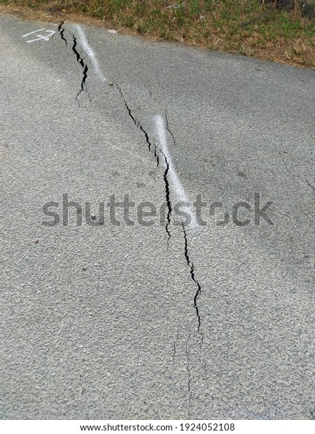 Roads\
cracked down as a result of landslides. A landslide is defined as\
the movement of a mass of rock, debris, or earth down a slope. Soil\
Settlement due to vertical movement of the\
ground.