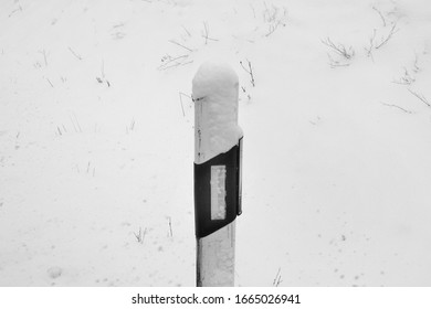 Roadside Bollard Covered With Snow