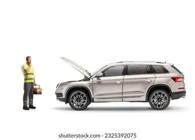 Roadside car mechanic holding a tool box and looking at a SUV with an open hood isolated on white background