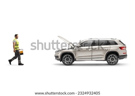 Roadside mechanic holding a tool box and walking towards a vehicle with an open hood isolated on white background