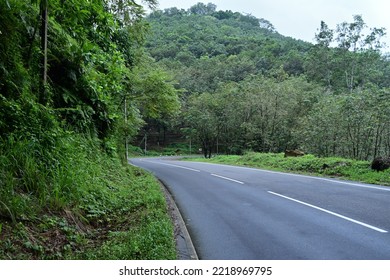 Roadside View Of A Steep Mountain Road On Rainy Day With Sharp Turn Ahead In Sri Lanka