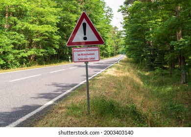 A Roadside Warning Sign With The Additional Sign With The German Inscription , African Swine Fever In Feral Pigs - Endangered Area.