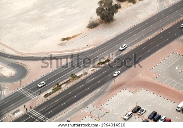 Roadway, cars on the road,\
intersection with traffic lights, pedestrian crossing, top\
view.